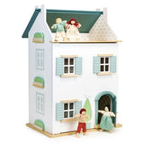 Wooden Willow Dollhouse with three floors, pastel shutters, and four handmade dolls for imaginative play