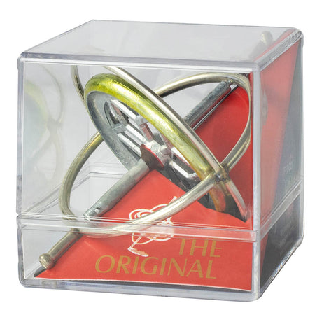 The Original Gyroscope in a clear plastic case showcasing its metal rings and red base for educational play.