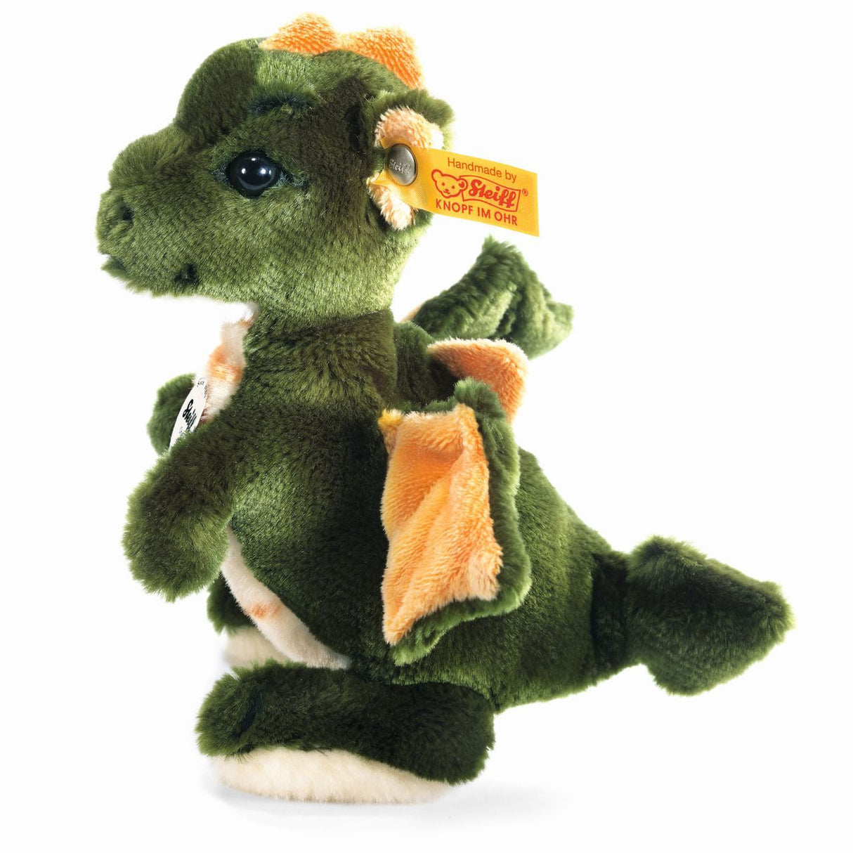 Dragon Raudi plush toy standing, handmade green soft fur dragon with orange wings and safety eyes.