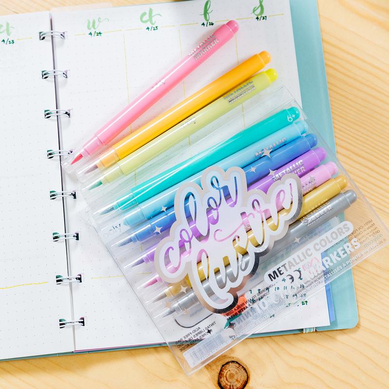 Color Lustre Metallic Brush Markers set with vibrant metallic colors and brush tip nibs for creative projects.