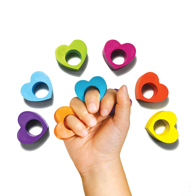 Heart Ring Crayons worn on fingers in six bright rainbow colors shaped like hearts for creative kids.