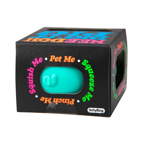 NeeDoh Dig It Pig stress ball in turquoise, packaged in a black box with colorful text and brand Schylling logo.