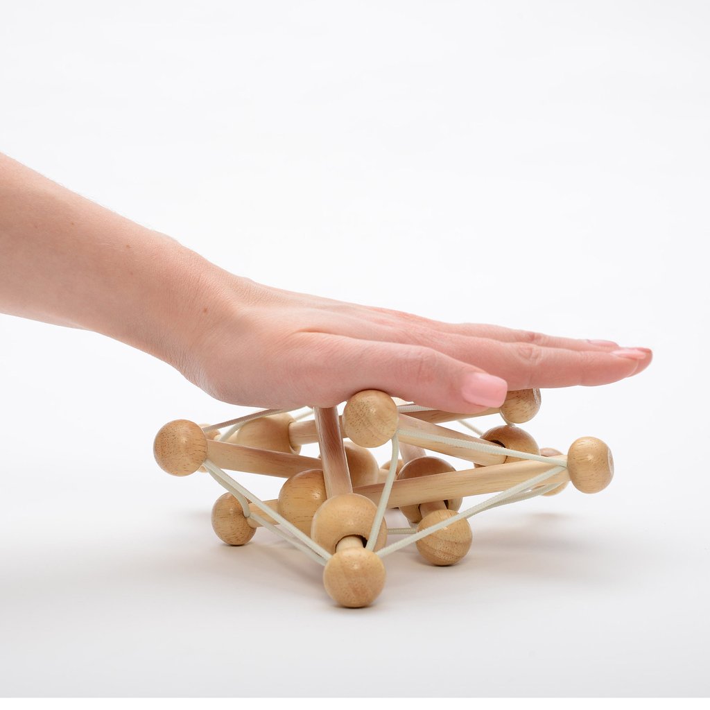 Natural Skwish wooden baby toy with elastic strings and beads that slide and rattle, safe for ages 0 and up.