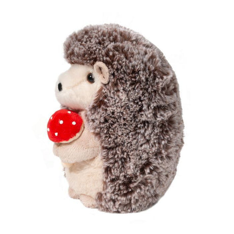 Hedgehog Stuey plush toy with soft spiky coat holding a red mushroom, cozy browns and warm cream colors.