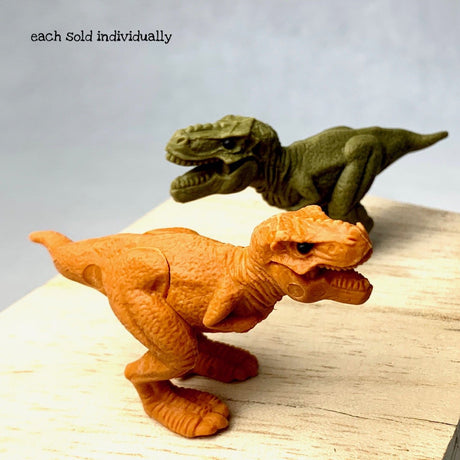 Japanese Eraser T-Rex puzzle erasers in orange and green, hand-assembled, for fun collectible dinosaur models.