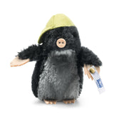 Maxi Mole plush collectible with black and gray mohair, pink felt paws, nose, and yellow felt cap, handmade in Germany.