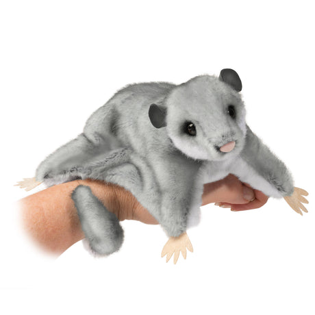 Sugar Glider Squeek plush toy resting on hand showing soft fur, curled tail, and lifelike features.