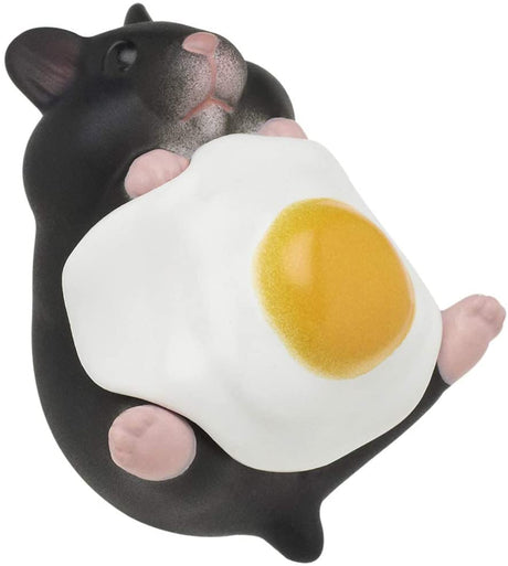 Hamster N Egg Blind Box featuring a cute black hamster figurine holding a sunny side up egg accessory.