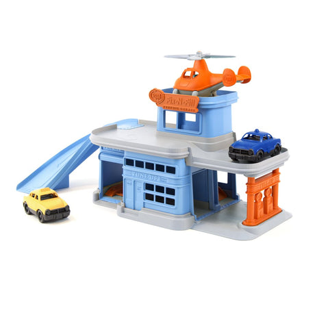 Green Toys Parking Garage playset with ramp, helicopter, and two vehicles, made from 100% recycled plastic.