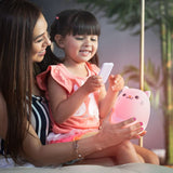LED Nightlight | Cat with glowing pink light held by a smiling child and mother using a remote control.