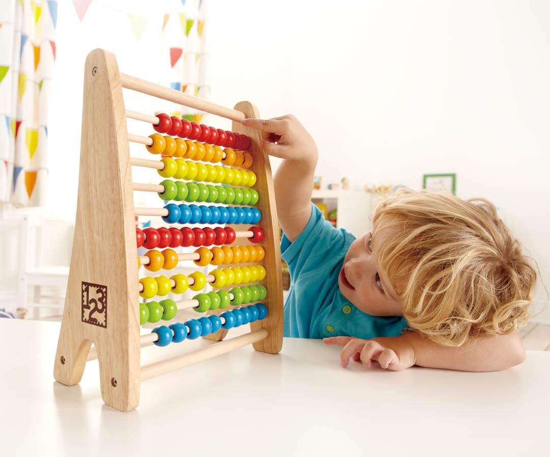 Child playing with the colorful wooden Abacus, a fun learning toy for counting and color recognition.