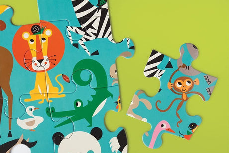 Close-up of colorful animal pieces in the 25pc World Animals Jumbo Puzzle on a green background.