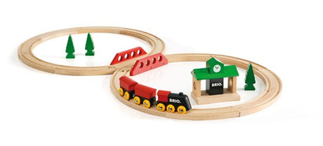Figure 8 Set wooden train tracks with engine, station, trees, and bridge for children ages 2 and up.