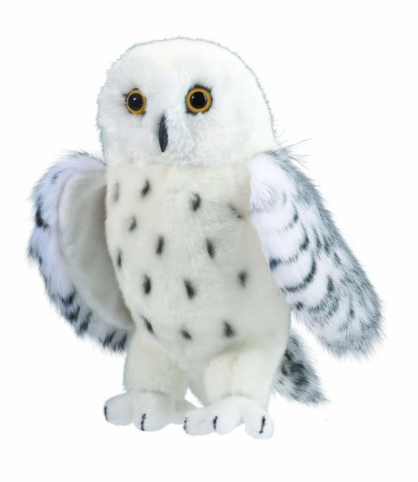 Snowy Owl Legend plush toy with soft white fur, black markings, fluffy wings, and big yellow eyes, standing 10 inches tall.