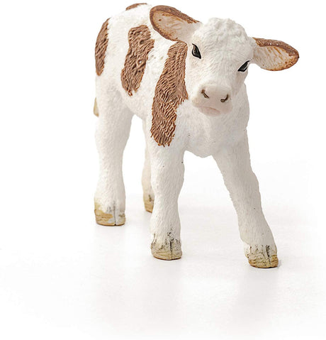 Simmental Calf figurine with white and brown markings, standing and looking forward in a friendly pose.