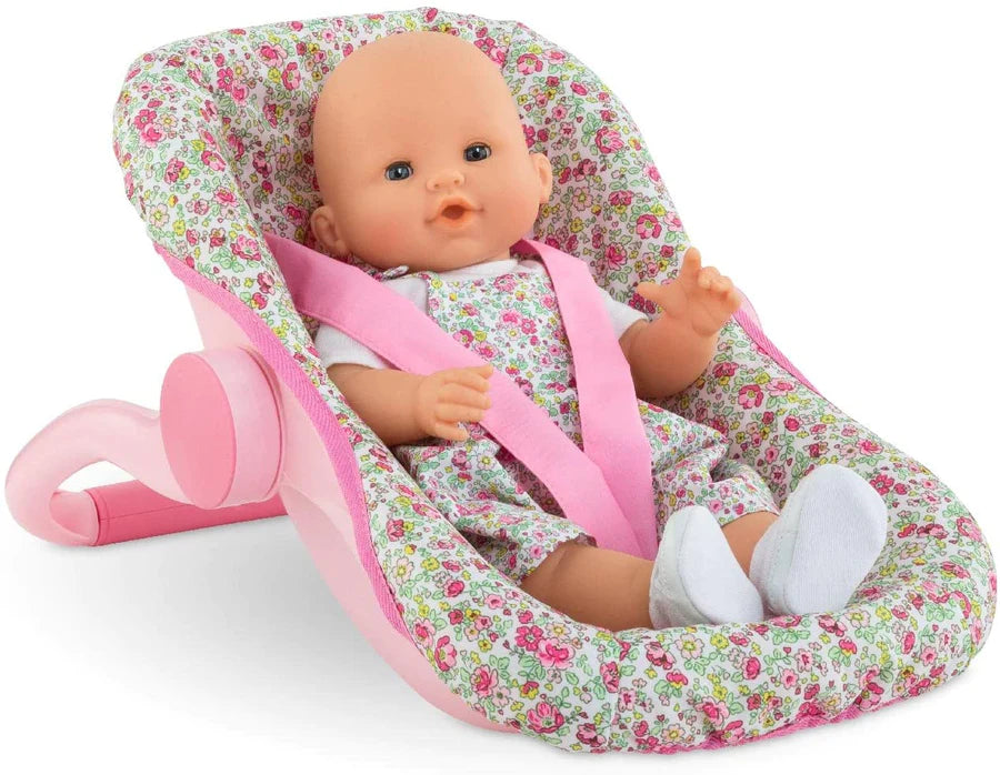Car Seat Carrier Floral with pink floral fabric and baby doll seated comfortably with safety straps.