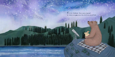 A page from A is for Always: An Adoption Alphabet showing a bear and rabbit stargazing by a lake under a starry sky.