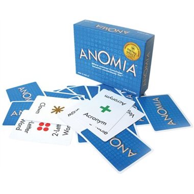 Anomia card game box and scattered playing cards featuring symbols and words for fast-paced matching fun.