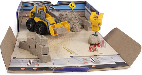 Kinetic Sand Dig & Demolish playset with brown kinetic sand, brick mold, construction truck, and jackhammer in play box.