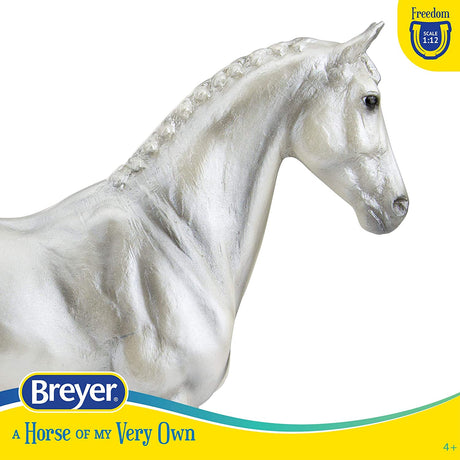 Grey Trakehner model horse in pearl grey with braided mane, realistic details, part of Breyer Freedom Series 1:12 scale.