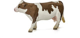 Simmental Cow figurine with white head, legs, and belly, featuring light gold to reddish brown patches.