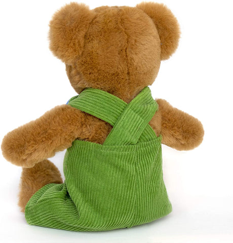 Corduroy plush bear with soft caramel fur wearing rich green corduroy overalls, shown from the back.