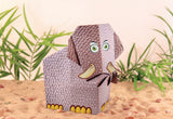 My First Origami Kit showing a textured paper mammoth model with fun stickers and detailed folding design in a sandy setting.