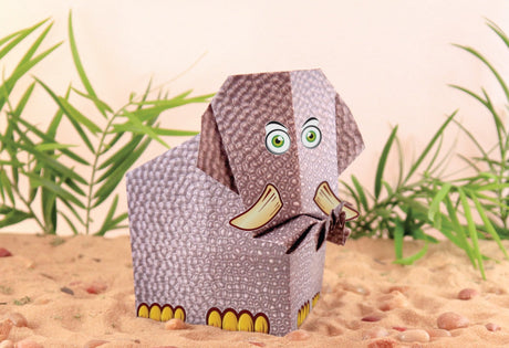 My First Origami Kit showing a textured paper mammoth model with fun stickers and detailed folding design in a sandy setting.