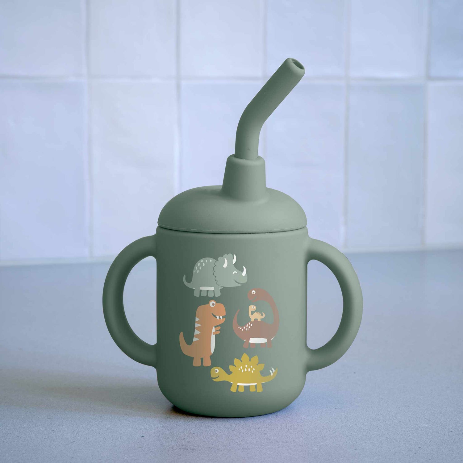 Fresh & Messy Sippy Cup | Baby Dinosaur with two handles, silicone straw, and playful dinosaur graphics for kids.