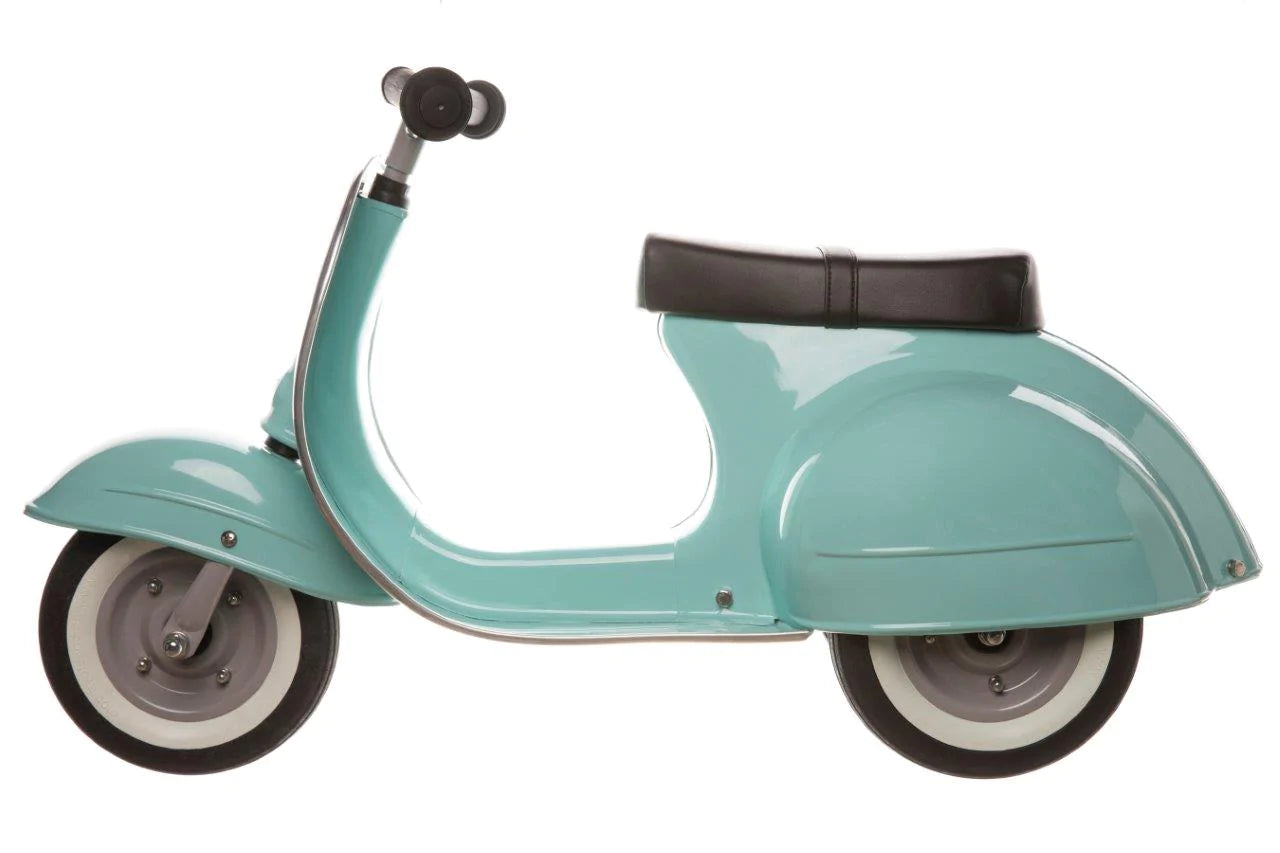 Primo Ride On Mint toddler scooter with durable metal frame, powder coated finish, and classic white-walled wheels.