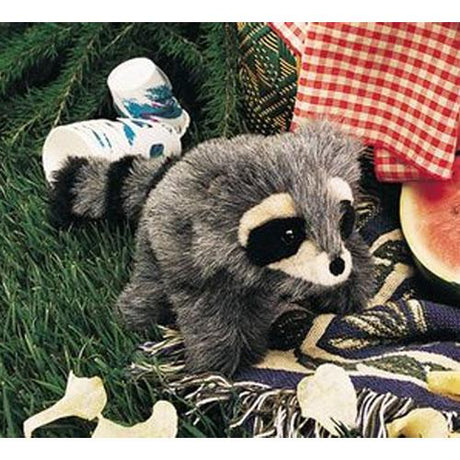 Baby Raccoon Puppet sitting on a picnic blanket with soft gray fur and black masked eyes.