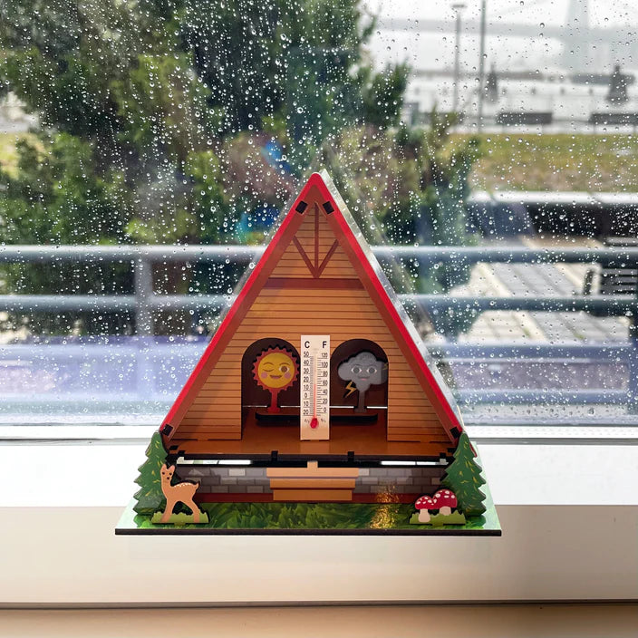 Make Your Own Weather House DIY hygrometer shows sun or cloud to indicate sunny or rainy weather indoors.