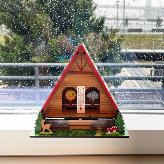 Make Your Own Weather House DIY hygrometer shows sun or cloud to indicate sunny or rainy weather indoors.