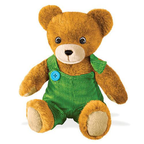Corduroy teddy bear with soft caramel fur wearing green corduroy overalls and a removable blue button detail.