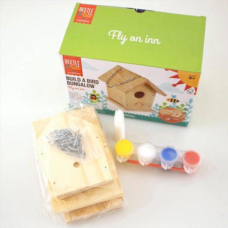 Build a Bird Bungalow kit with wooden pieces, glue, paint pots, and brush for kids 5 and up to create a birdhouse.