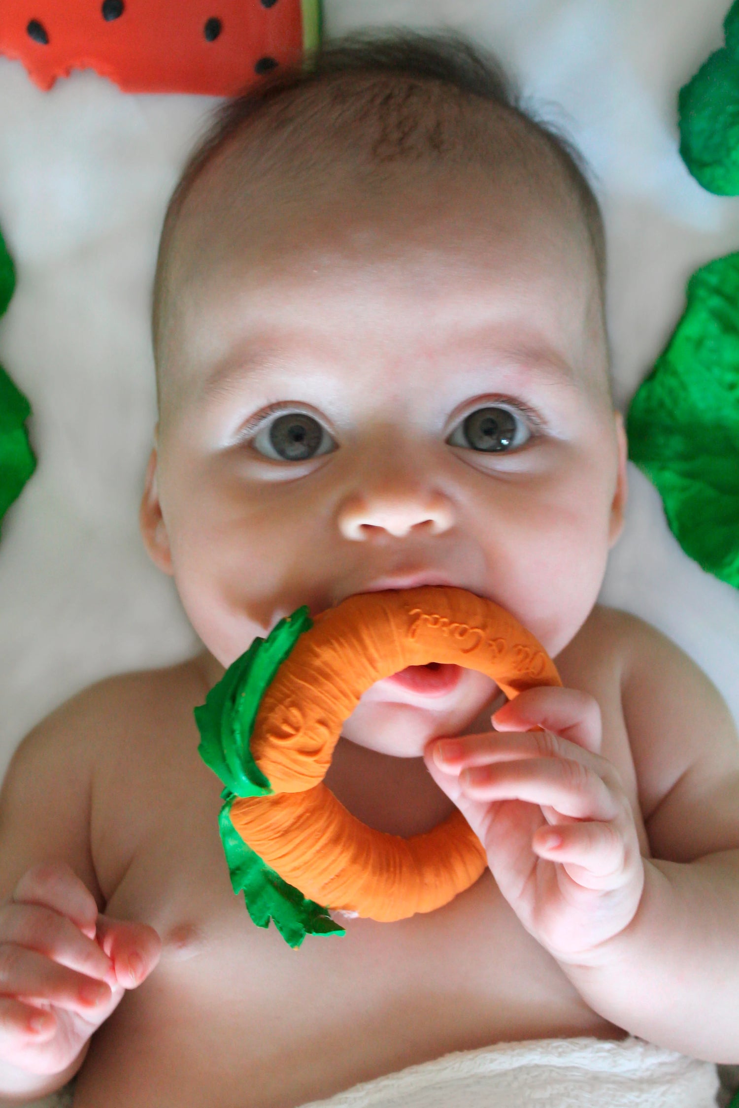 Baby chewing on Natural Teether | Cathy the Carrot made of 100% natural rubber, safe and soft for teething.