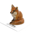 Critterz Red Fox Brush miniature porcelain figurine, hand painted, detailed small collectible fox figurine sitting with bushy tail.