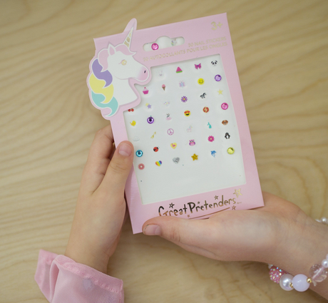 Nail Stickers | Unicorns showing a pink package with 50 colorful unicorn and fun-themed nail decals for kids.