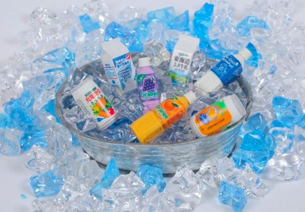 Japanese Eraser Drink puzzle eraser toys displayed in assorted beverage designs in a bowl of decorative ice.