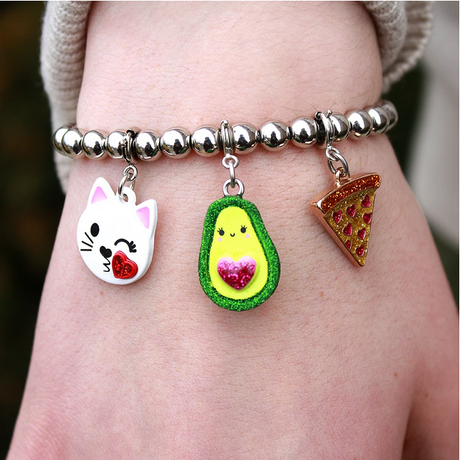 Glitter Avocado Charm hanging on a silver bead bracelet with cat and pizza charms, 3D enamel with glitter details.
