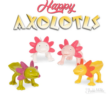 Happy Axolotls soft vinyl 3-inch amphibious toy in assorted colors, smiling and sold individually for ages 3 and up.