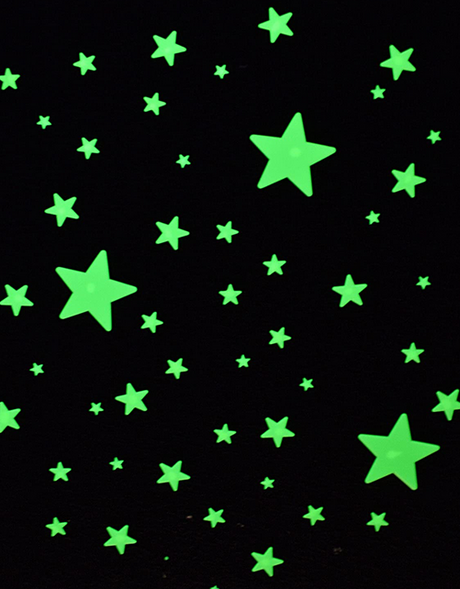 Glow Stars Super Kit glowing bright green stars scattered on a dark background for room decoration.