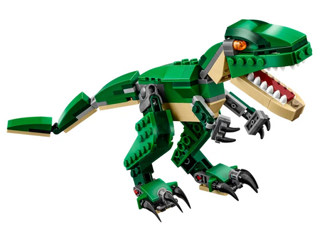 Creator Mighty Dinosaurs model of a green and beige T. rex with posable joints, bright orange eyes, and sharp claws.