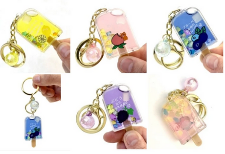 Fruit Popsicle Keychain in assorted colors with detailed fruit designs, key ring, and clip for bags or keys.