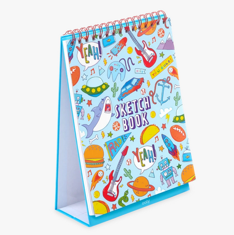 Awesome Doodles Sketchbook with colorful laminated cover featuring sharks, spaceships, guitars, and an easel-style stand for kids.