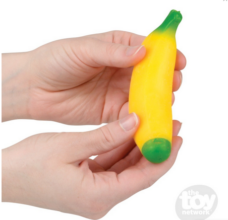 Hands holding a yellow and green Stretch & Squeeze Banana fidget toy for squeezing and stress relief.