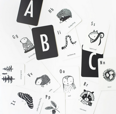 Woodland Alphabet Cards featuring black and white animal and nature illustrations with bold letters for learning.