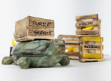 Soapstone Carving Turtle with wooden crate on its back, handcrafted detailed sculpture for creative art projects.
