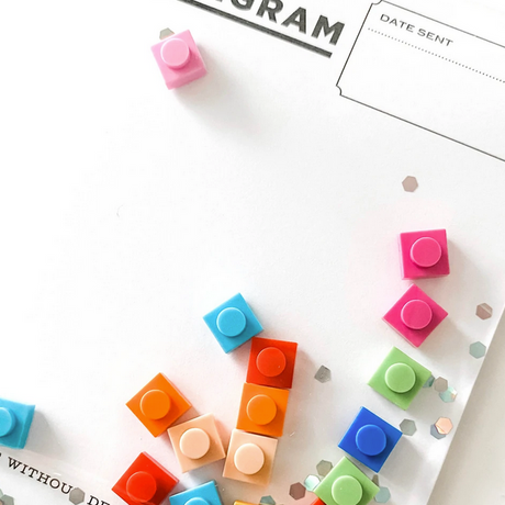 Bricks Confettigram Card with colorful resin confetti pieces on a clear envelope for a unique, playful message.