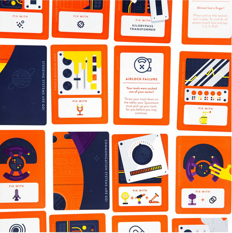 Spaceteam card game showing colorful repair and malfunction cards for cooperative spaceship teamwork.